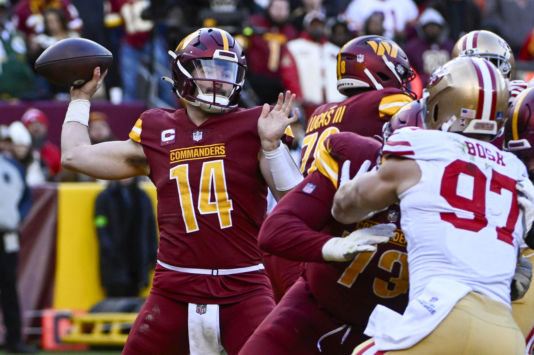Dec 31, 2023; Landover, Maryland, USA; Washington Commanders quarterback Sam Howell (14) attempts a pass against the San Francisco 49ers during the second half at FedExField.